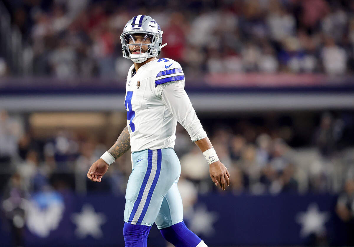 Dallas Cowboys quarterback Dak Prescott walks off the field after throwing an interception during the fourth quarter against the Tampa Bay Buccaneers on Thursday, Oct. 8, 2026, at AT&T Stadium in Arlington.